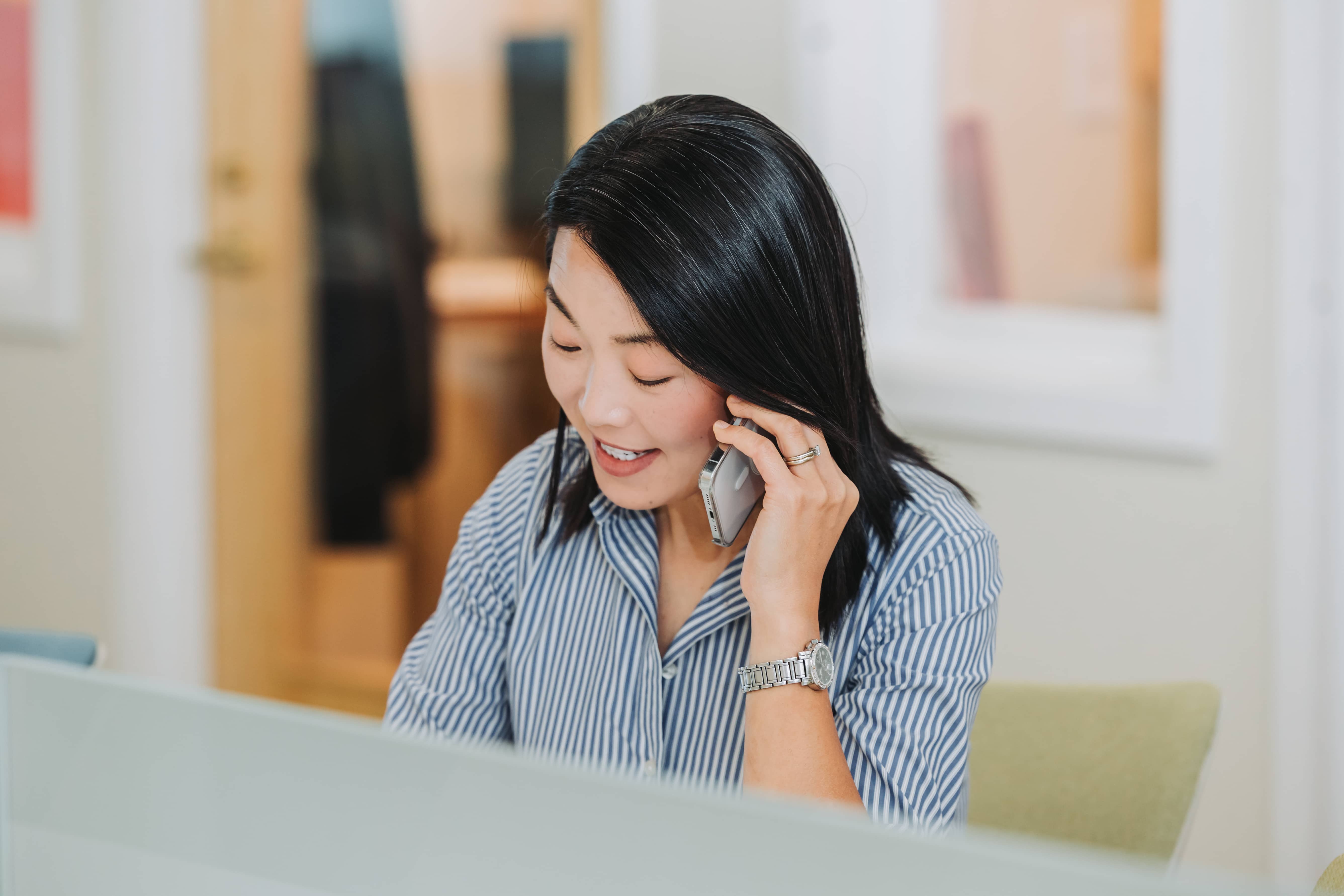 A member taking a phone call at Workspace Cohasset