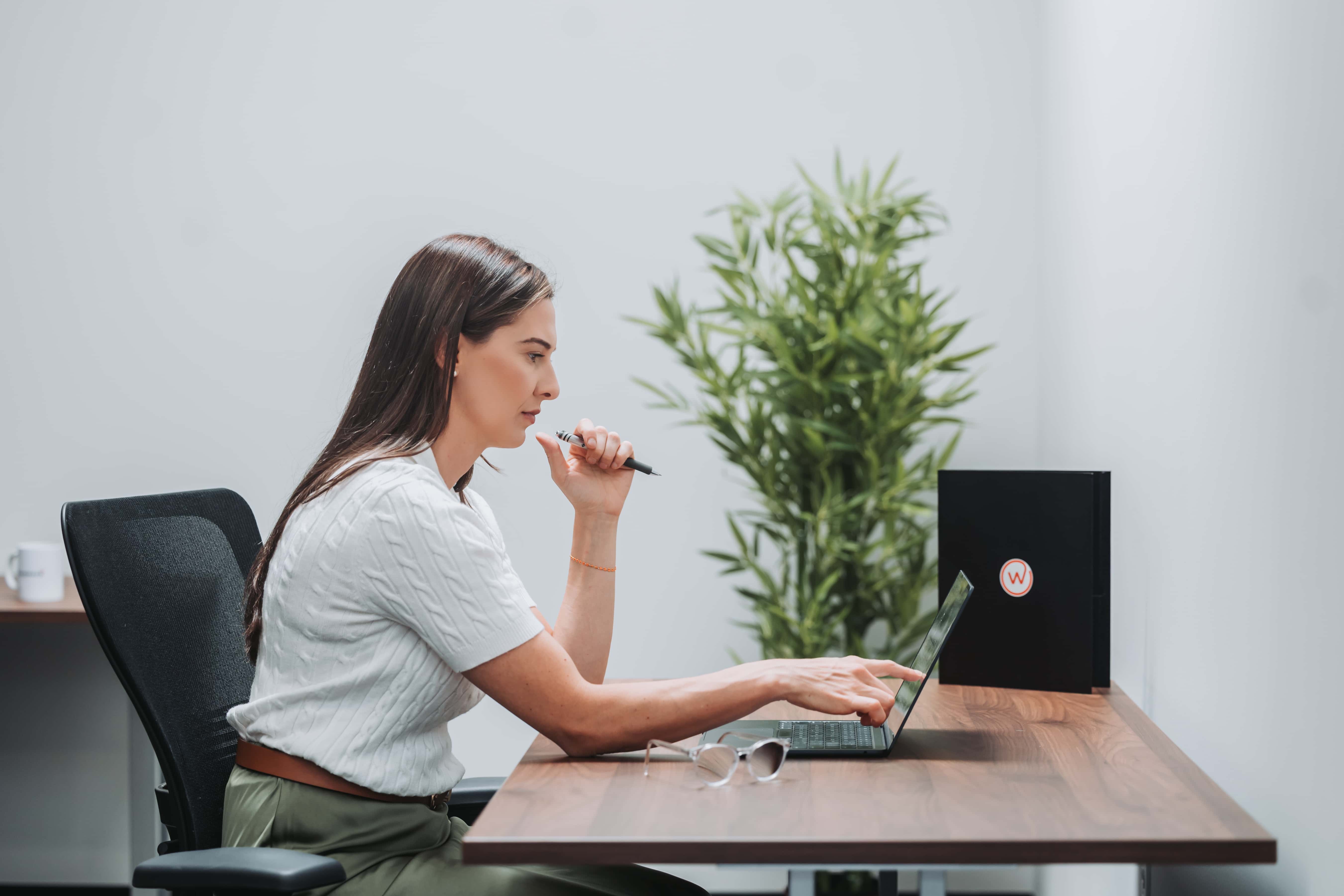 A member working at her desk at Workspace Beverly