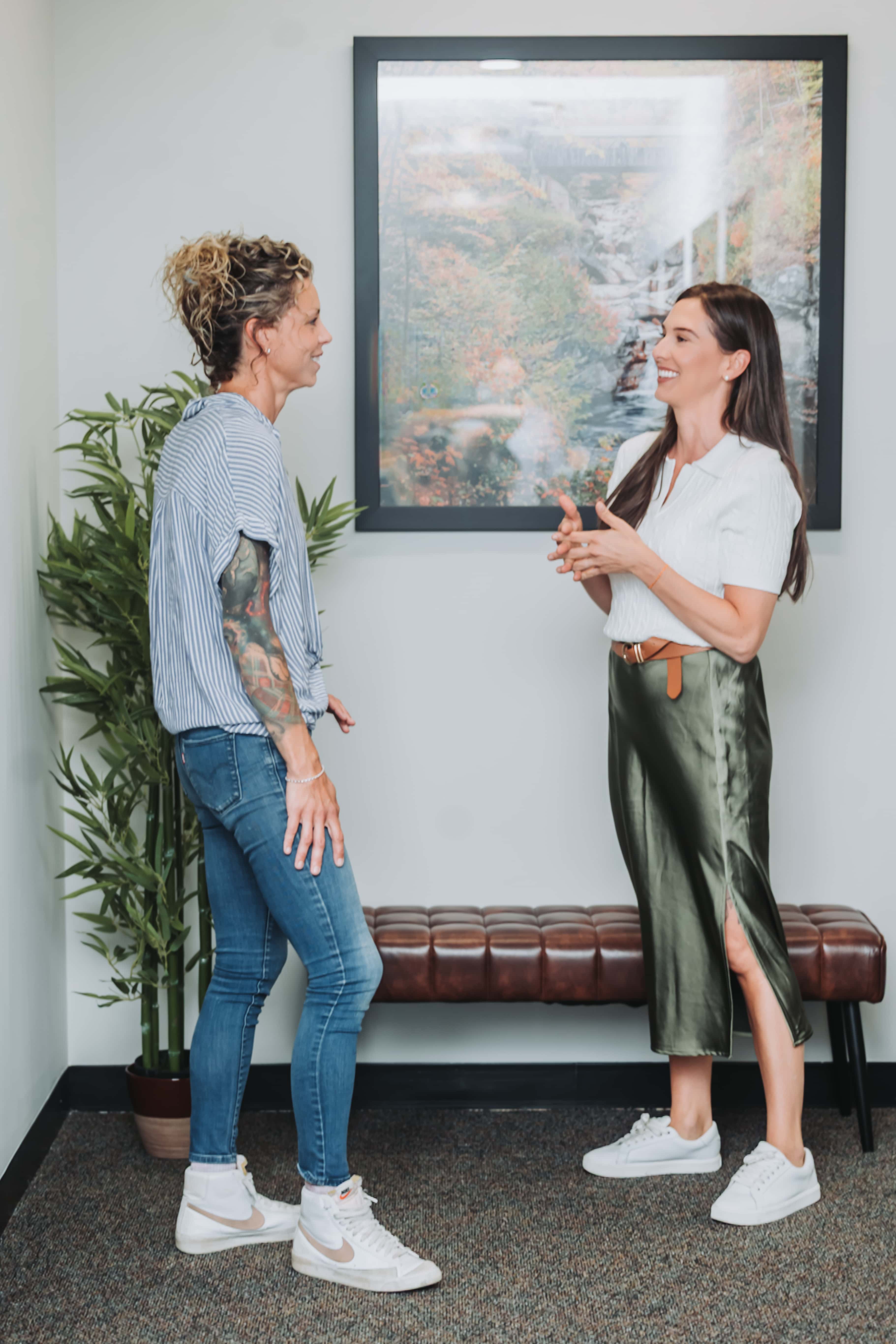 Two members catching up in a lounge at Workspace Beverly