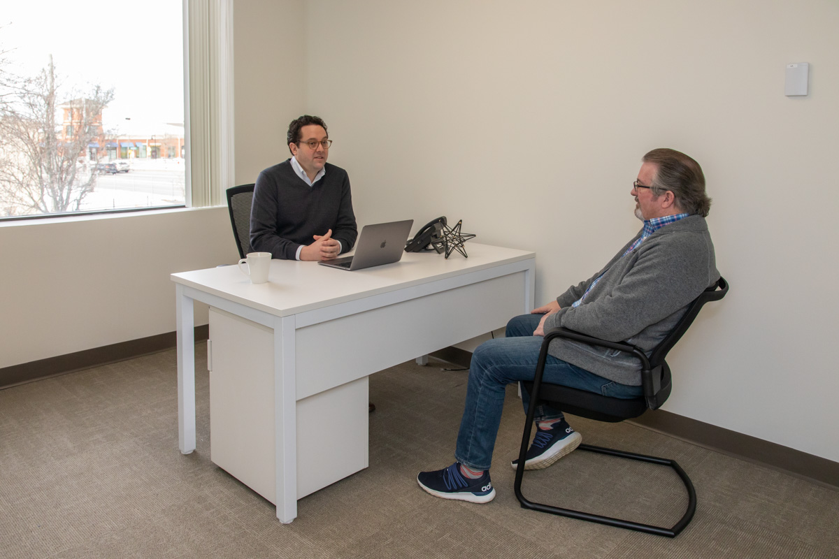 A member meeting with a client in his Workspace Hingham office